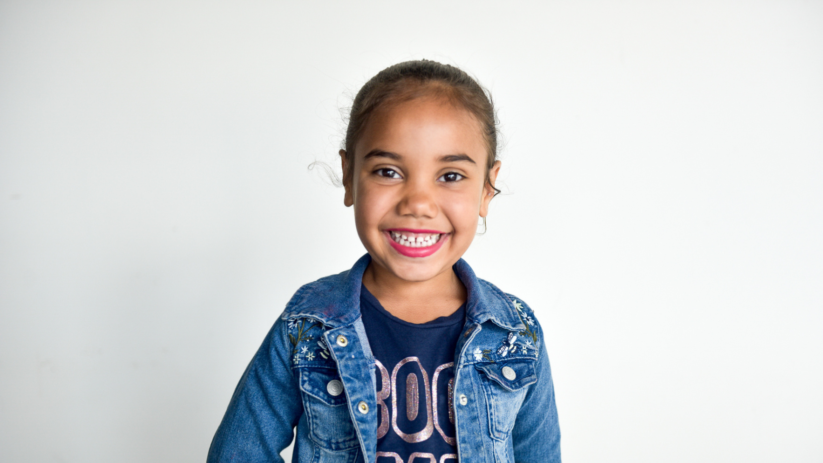Child smiling during daily routine with nanny in Los Angeles