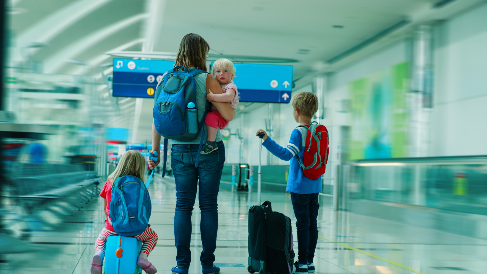 Child smiling during travel with nanny